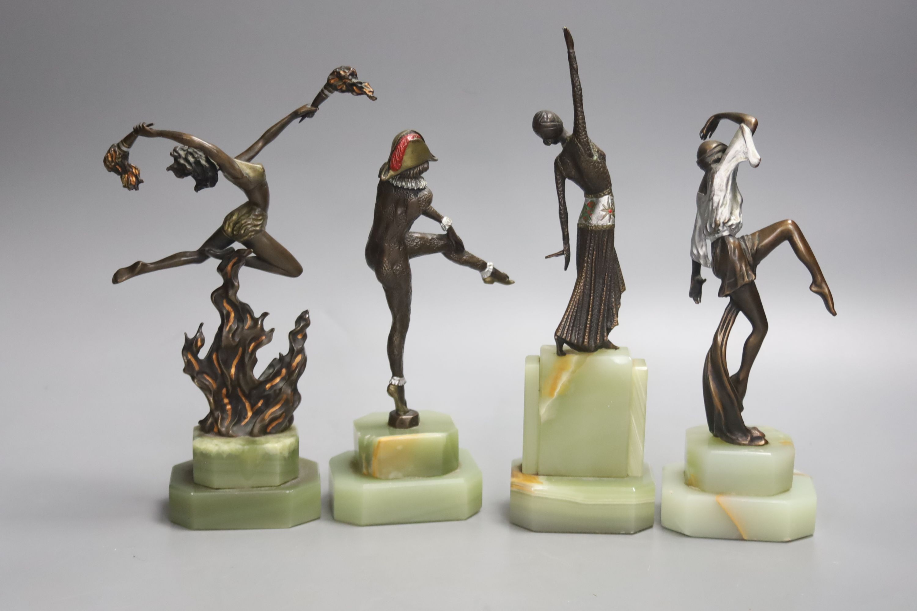 A group of four Art style bronze and oynx dancers, tallest 21.5cm